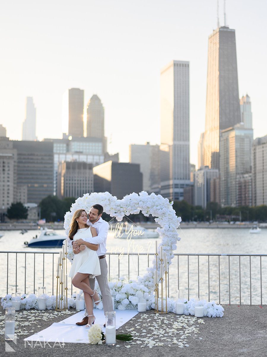 chicago proposal spots Olive Park hug with white roses arch