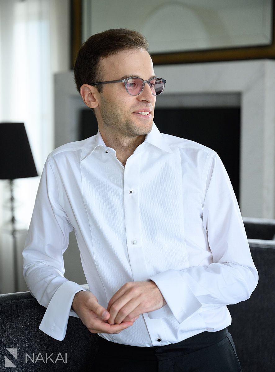 getting ready same sex marriage chicago groom in white shirt