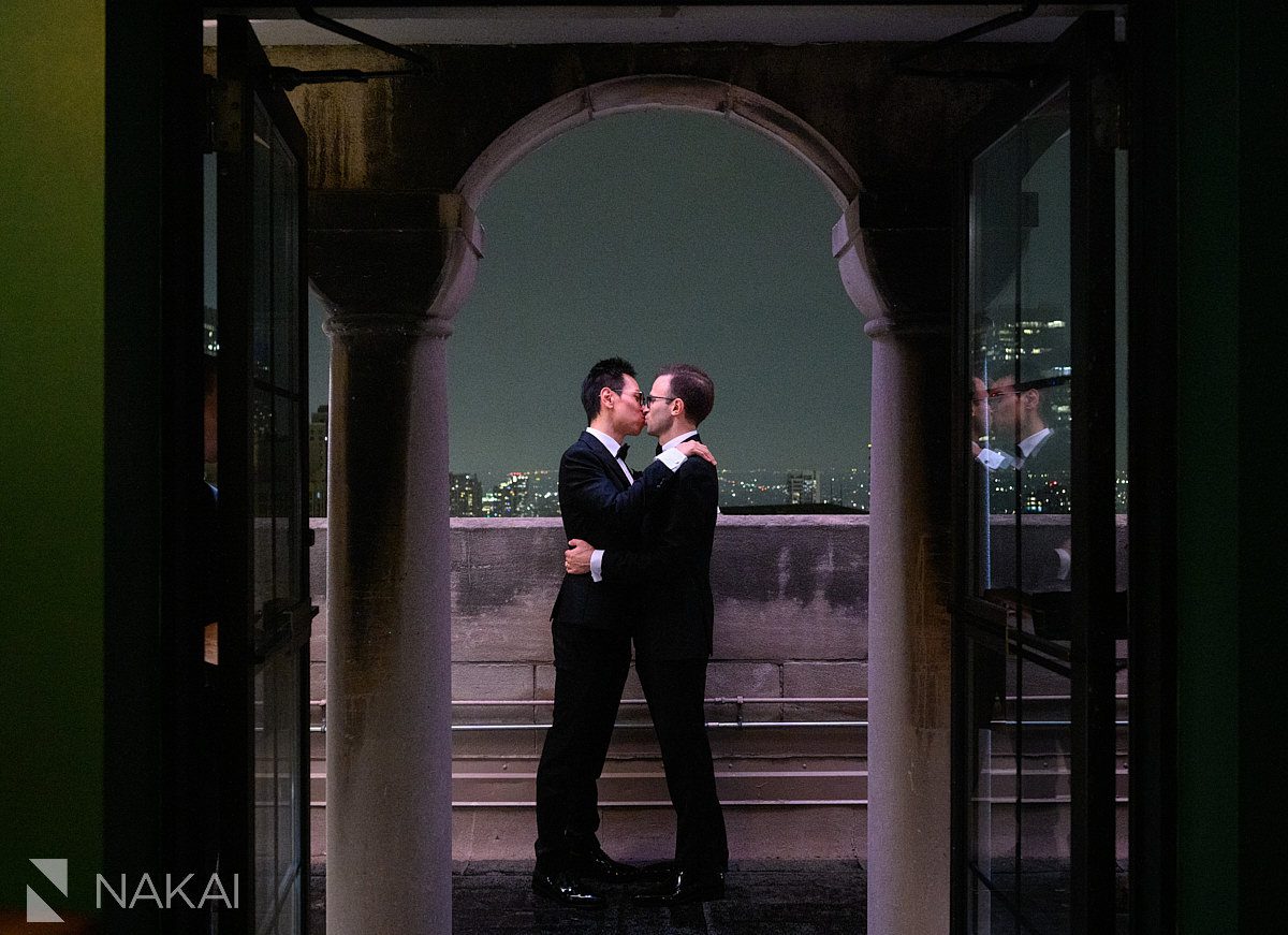 rooftop intercontinental chicago magnificent mile same sex marriage two grooms kissing