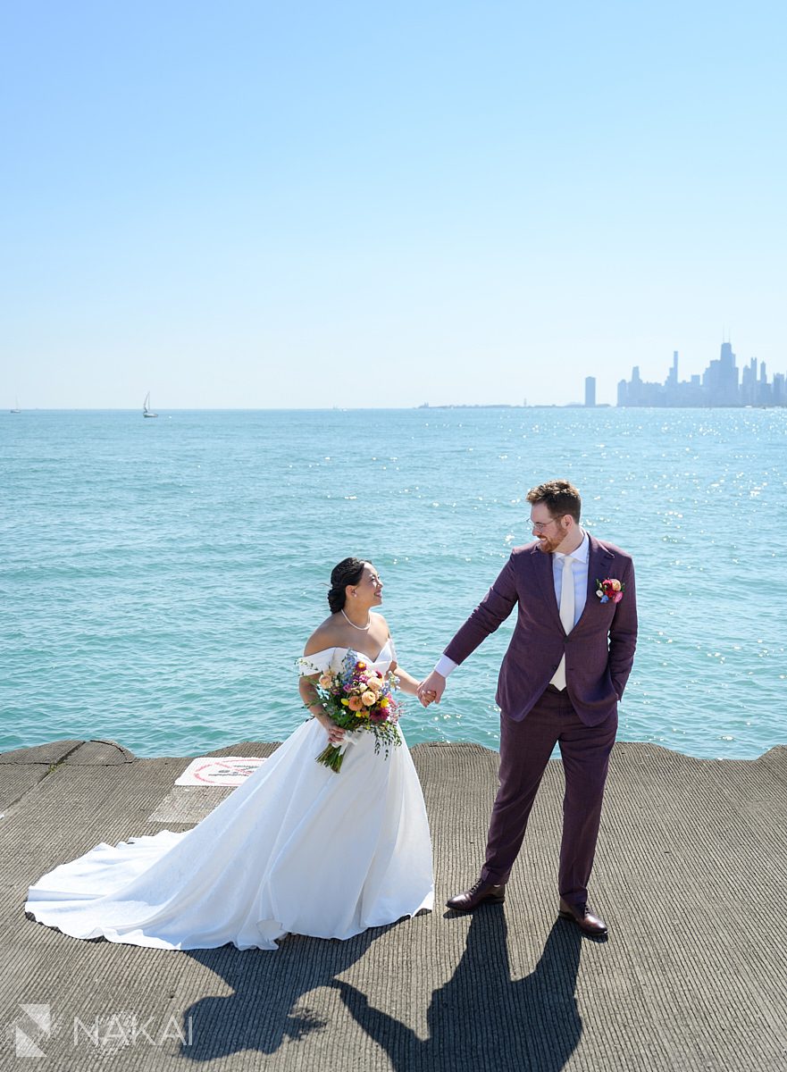 Chicago montrose beach wedding photos bride groom skyline in background