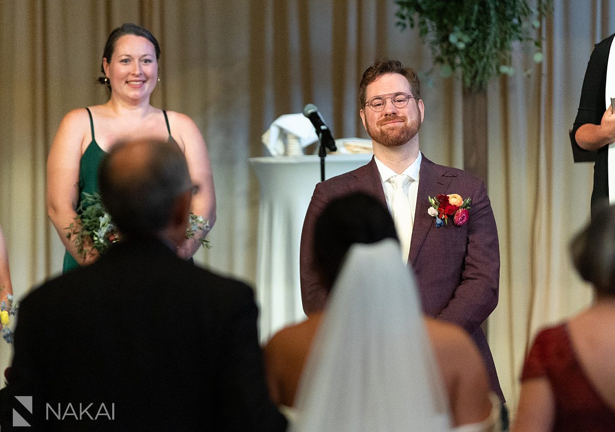 Chicago logan square church wedding ceremony groom looking at bride