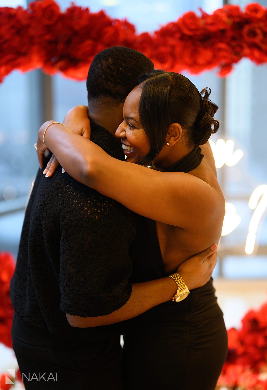 chicago luxury proposals during winter indoors, couple hugging afterwards