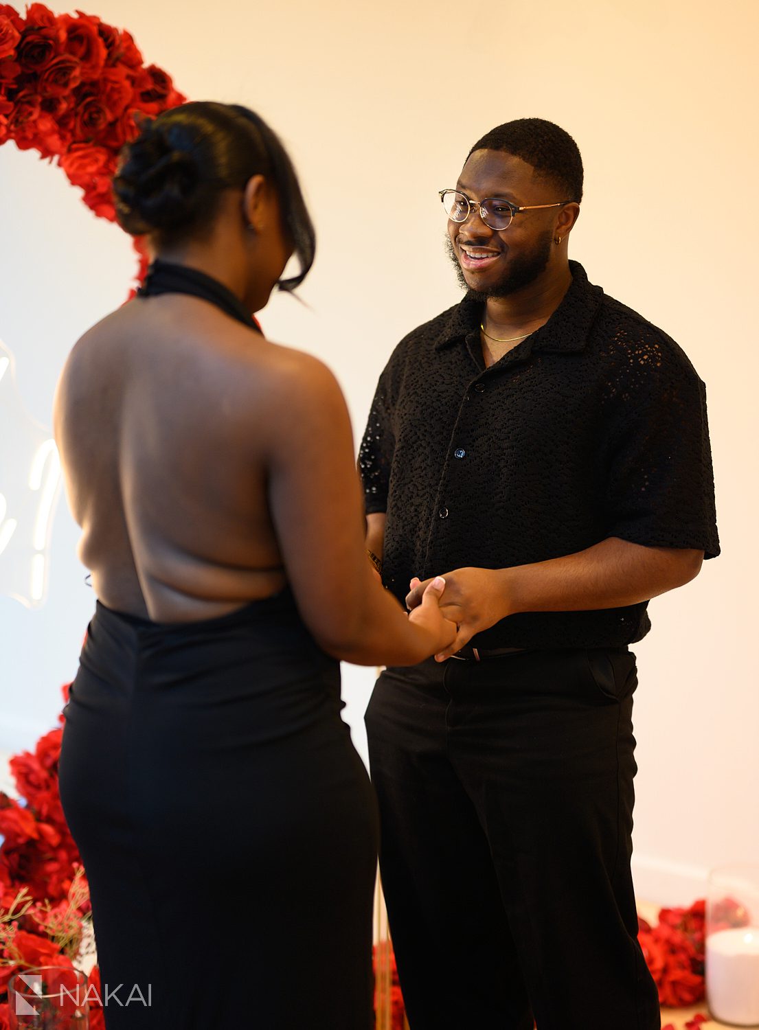 flower wreath chicago proposal couple holding hands