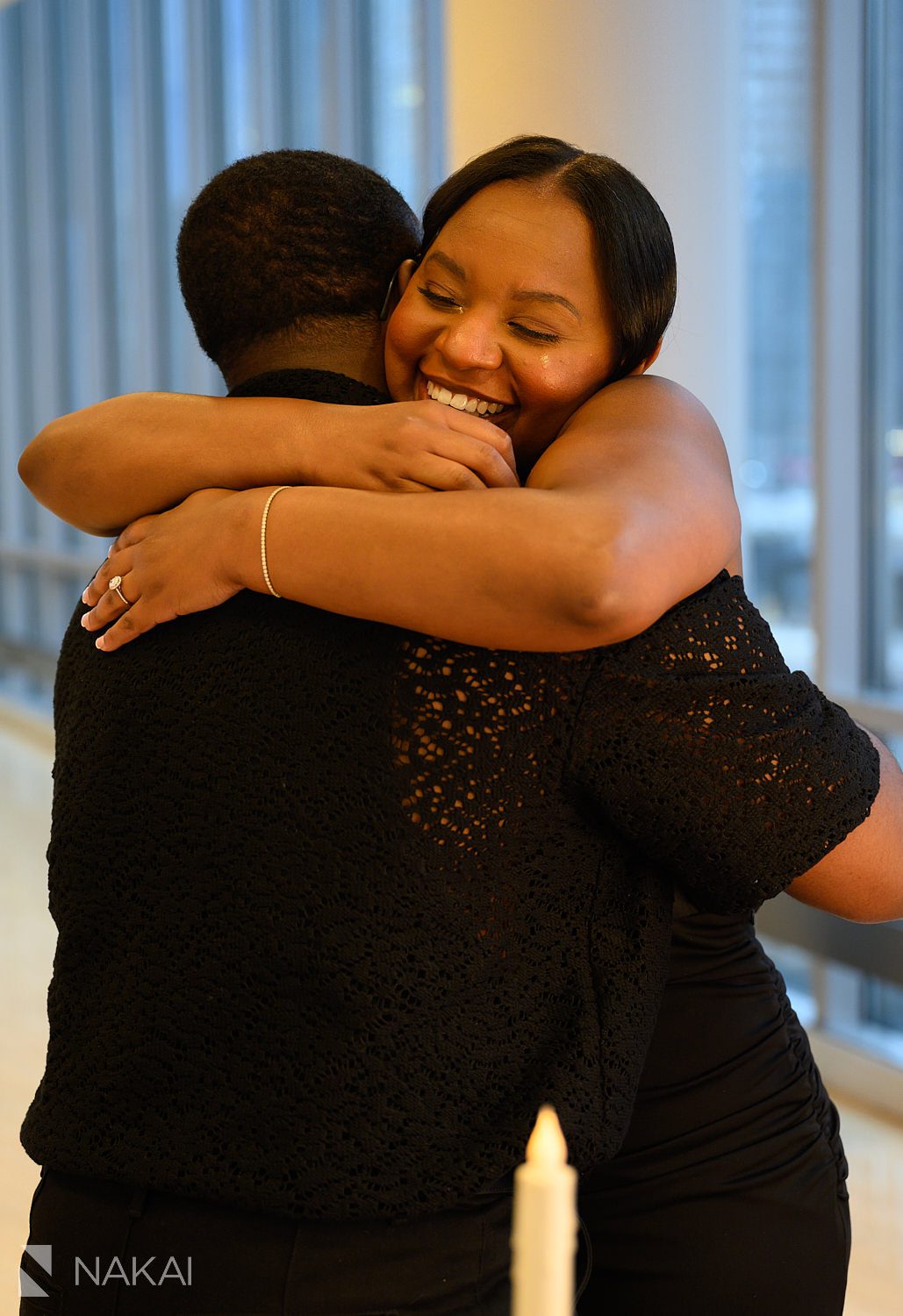 flower wreath chicago proposal couple hugging crying