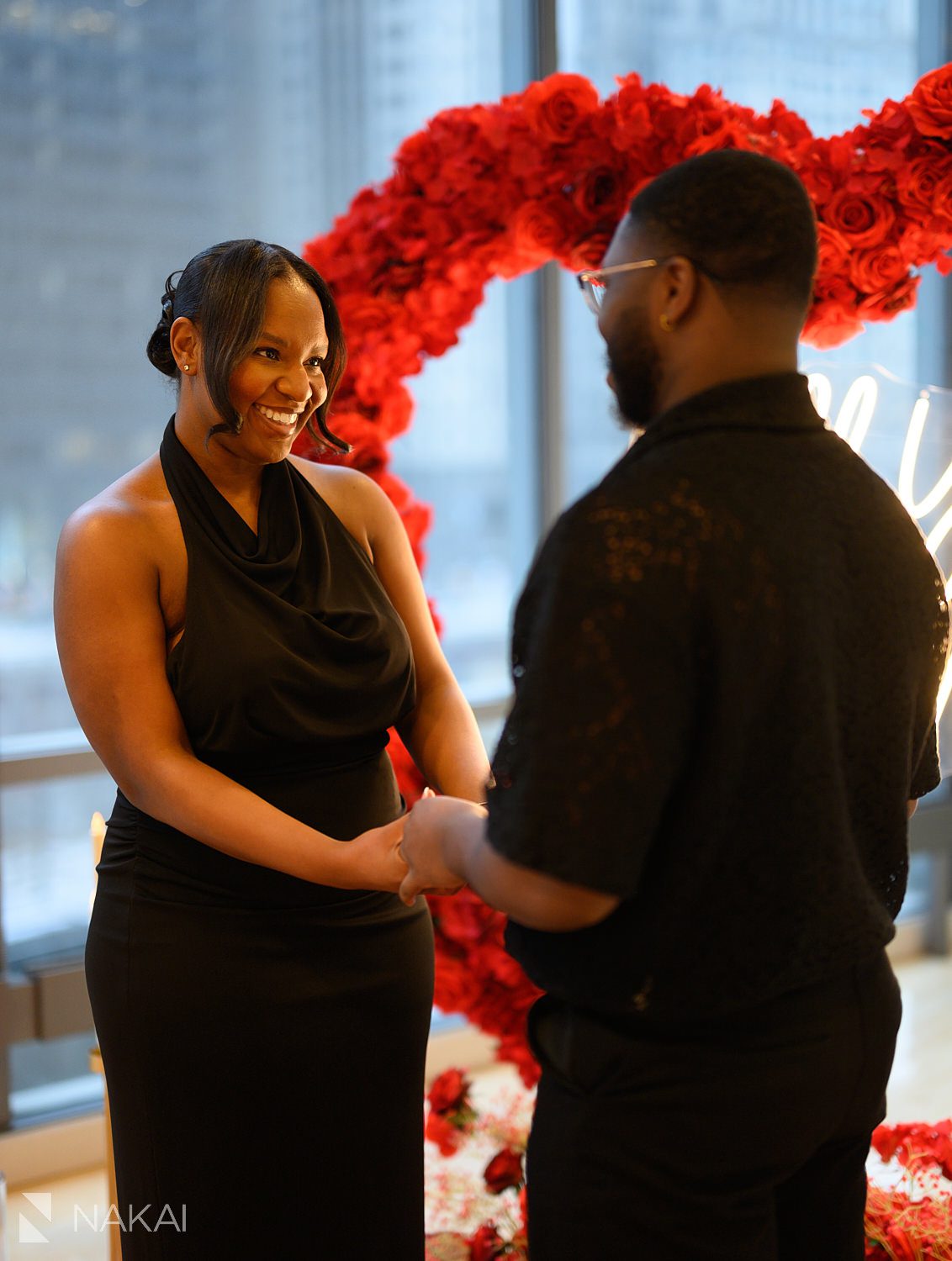 rose wreath chicago luxury proposals woman smiling holding hands