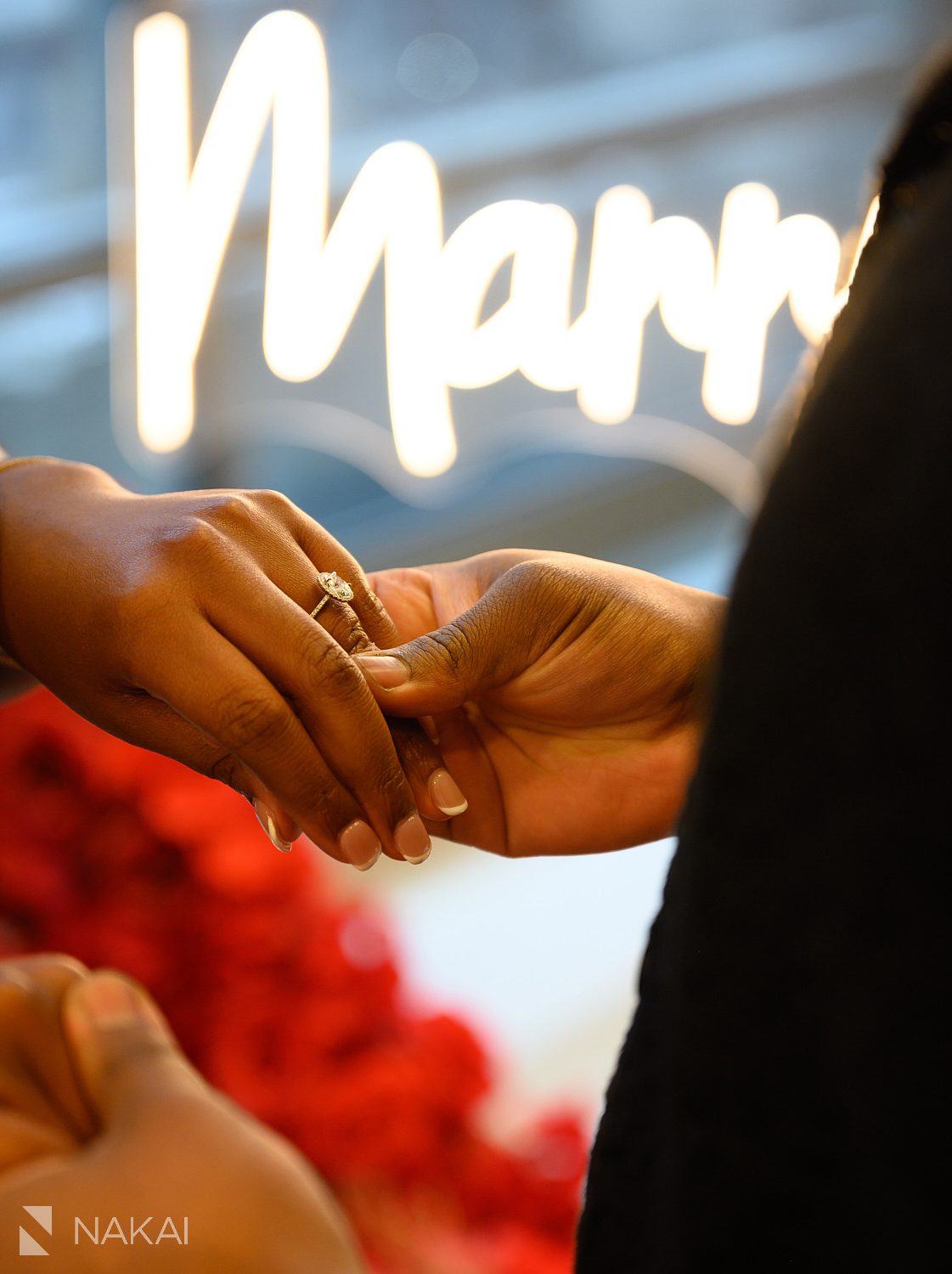 rose wreath chicago luxury proposals close up of ring on finger