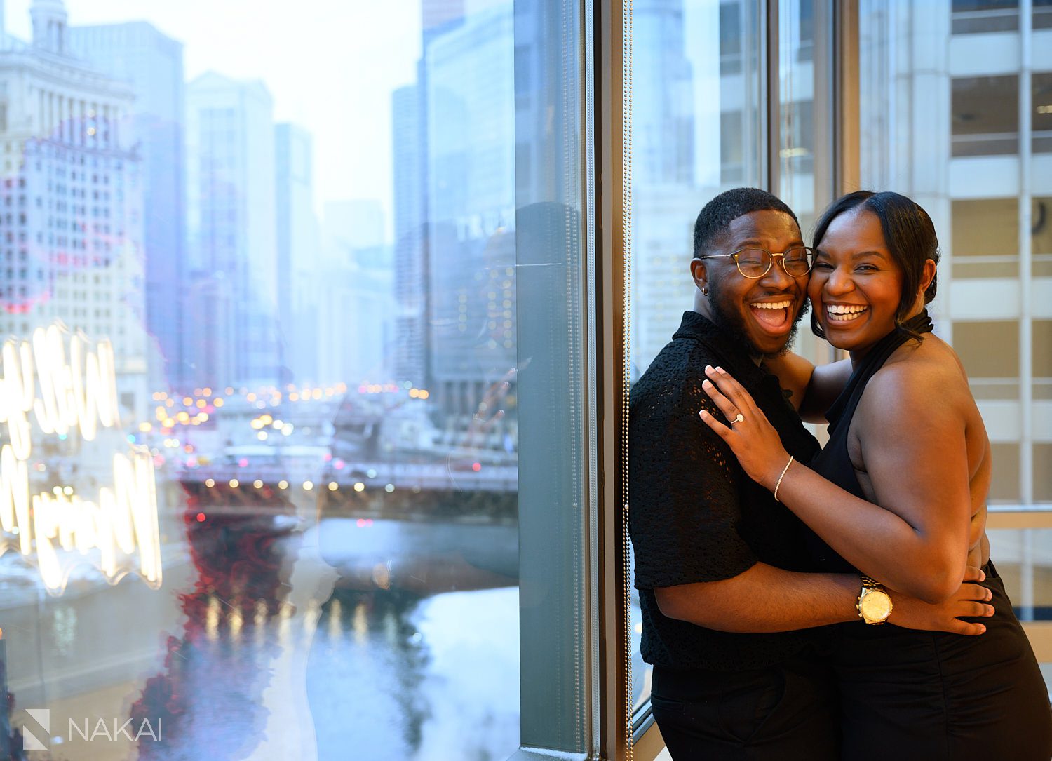 winter chicago luxury proposals by window overlooking riverwalk 