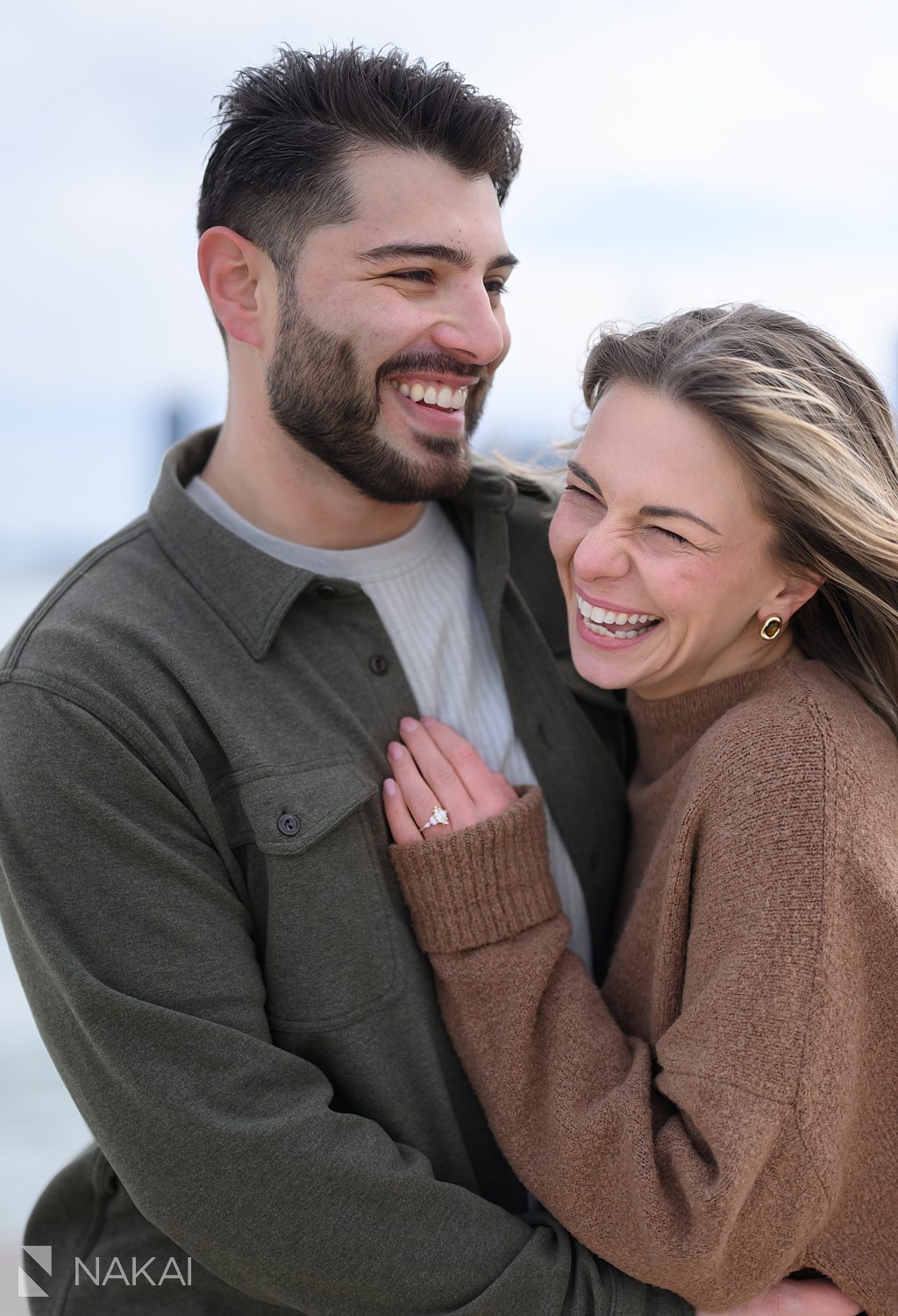 couple laughing during north ave beach proposal
