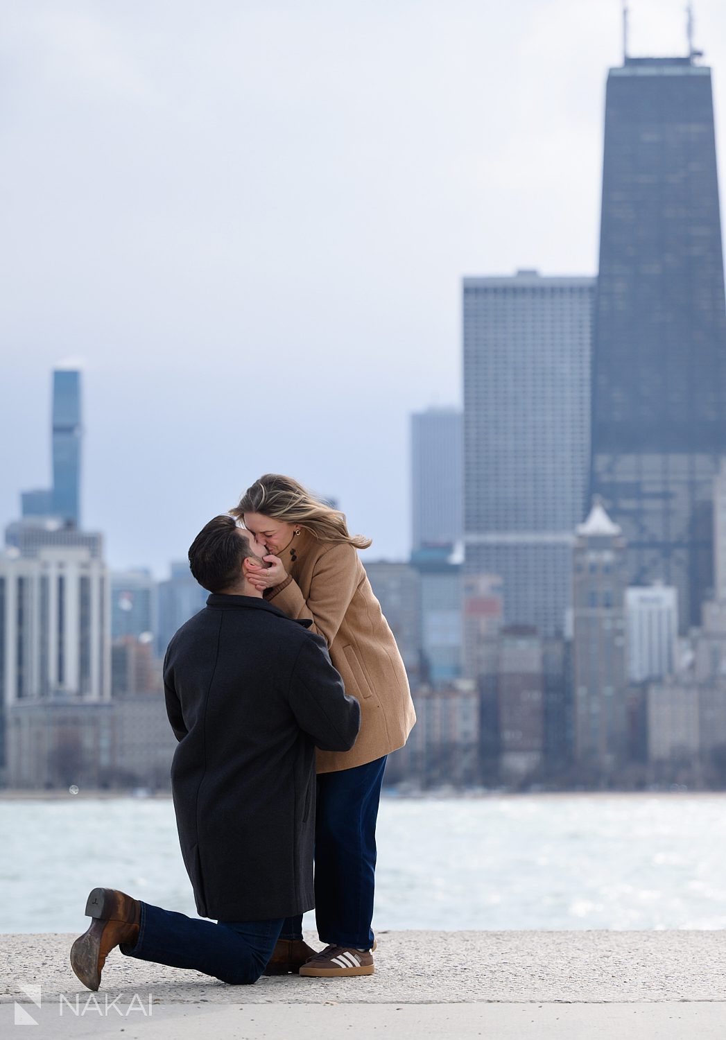 kiss during north ave beach proposal chicago on bended knee