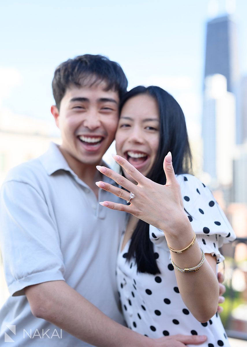 ambassador chicago private proposal laughing showing off ring