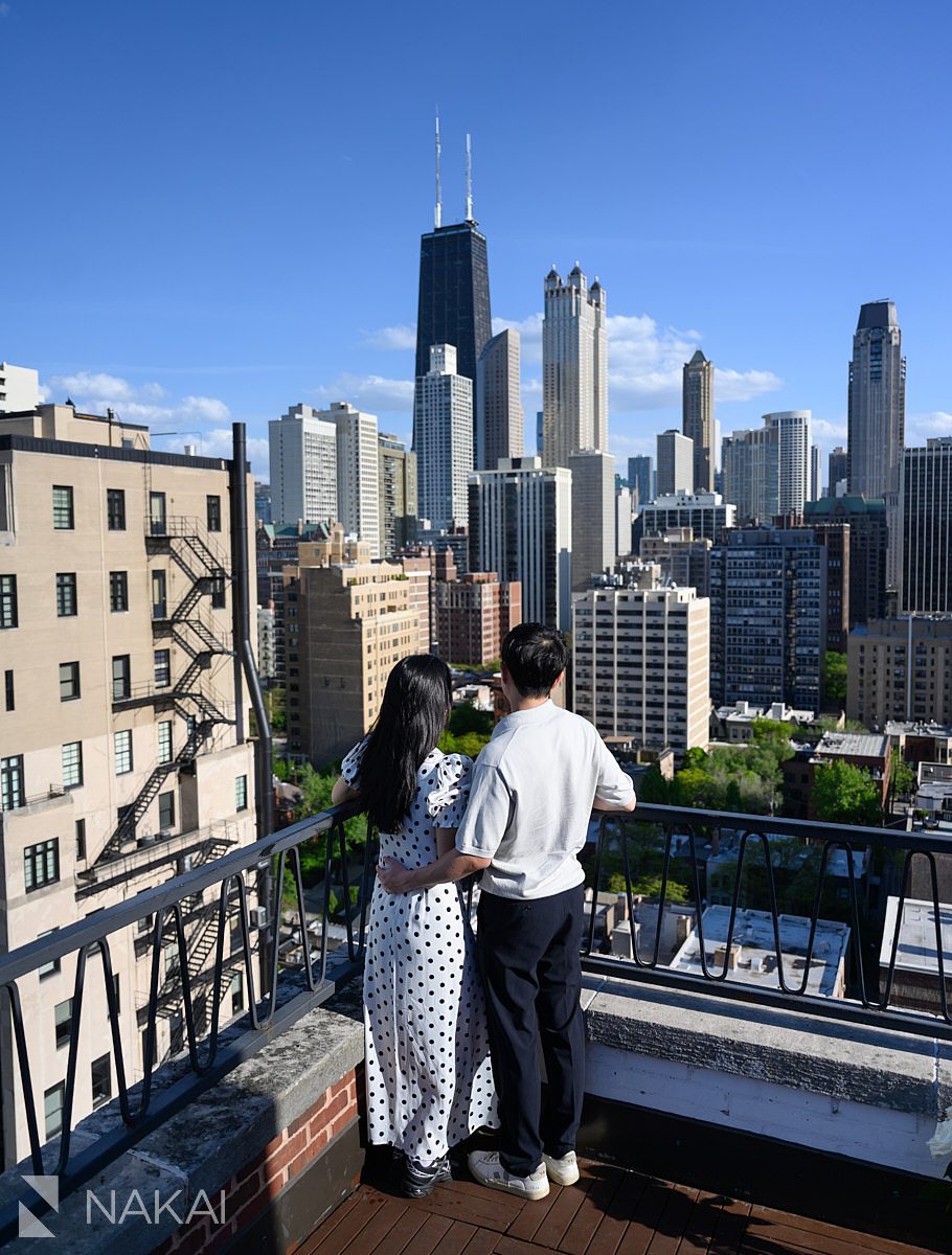 couple looking out at skyline ambassador chicago proposal rooftop
