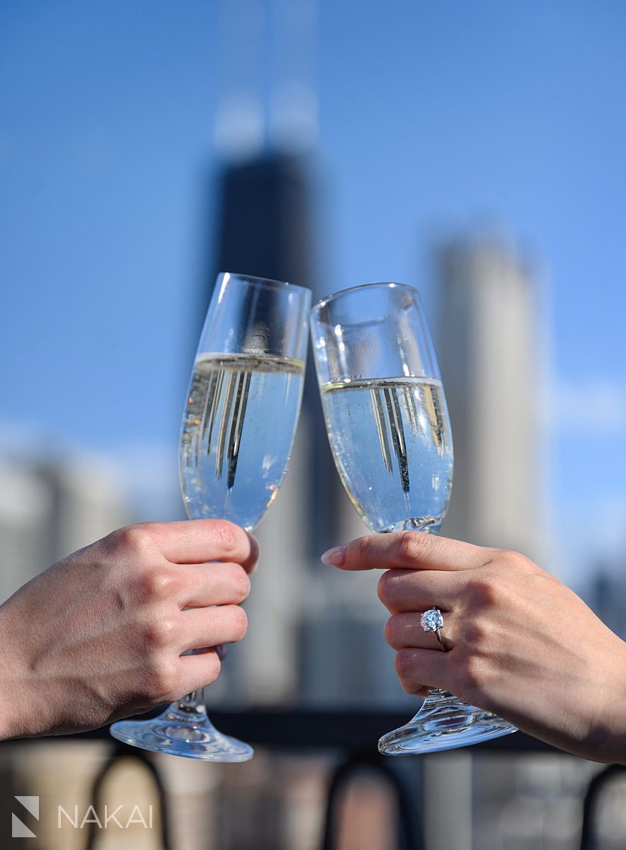 champagne glasses during ambassador chicago proposal rooftop