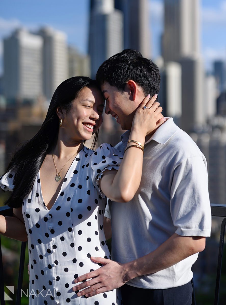 ambassador chicago proposal skyline in background on rooftop