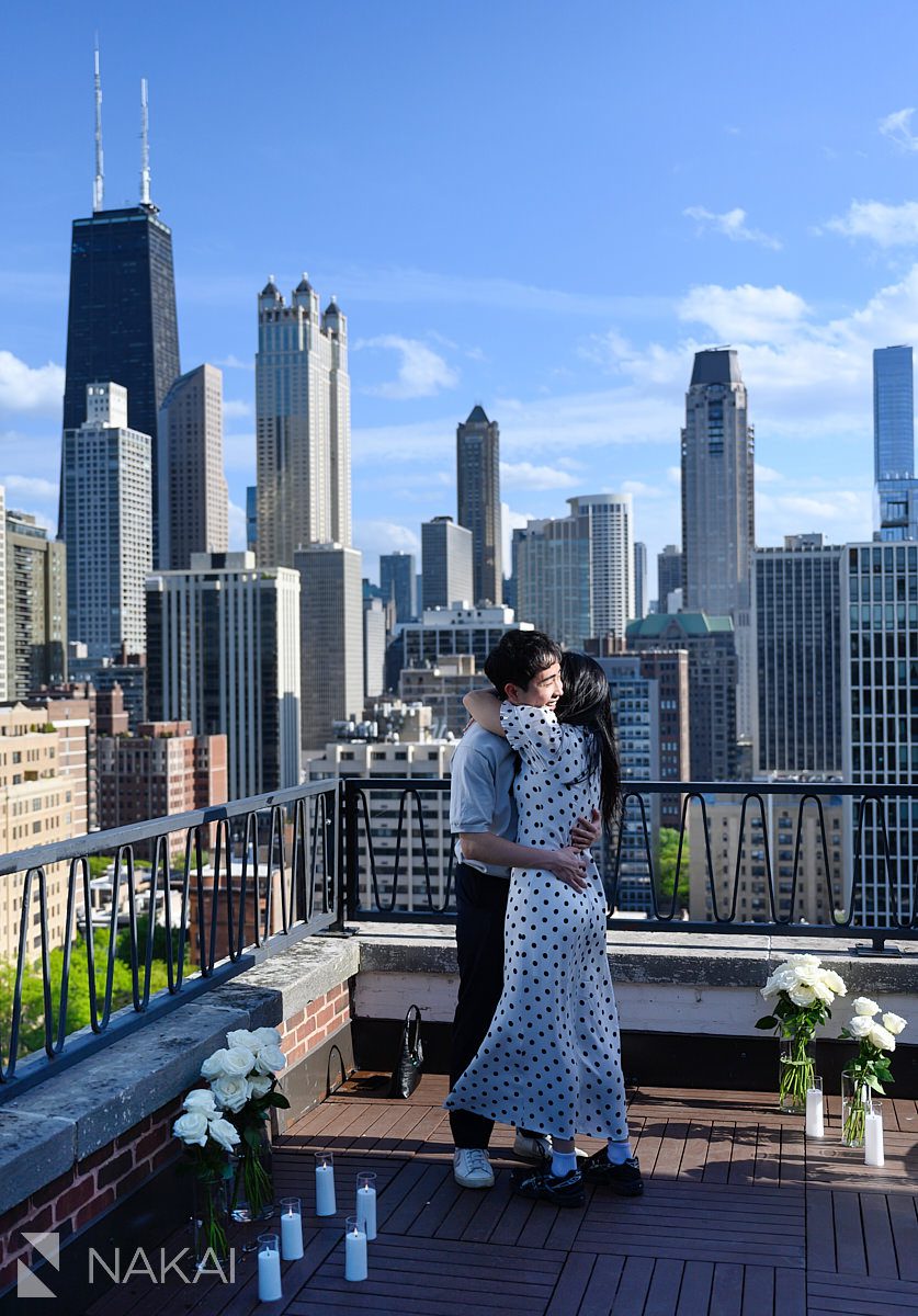 hugging at chicago private proposal ambassador rooftop