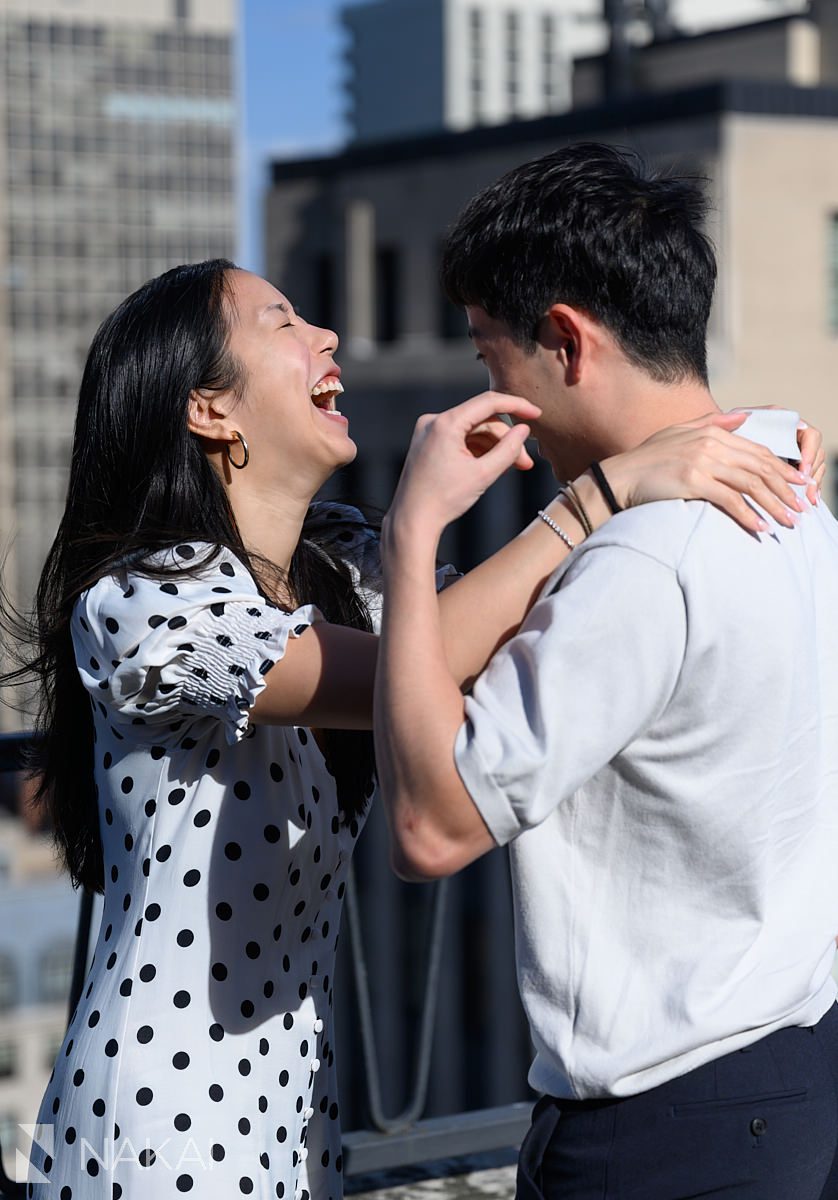 nervous laughing at chicago private proposal rooftop