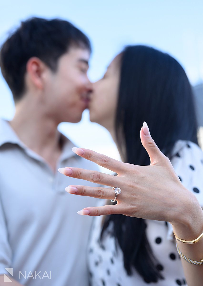 kiss with ring in foreground