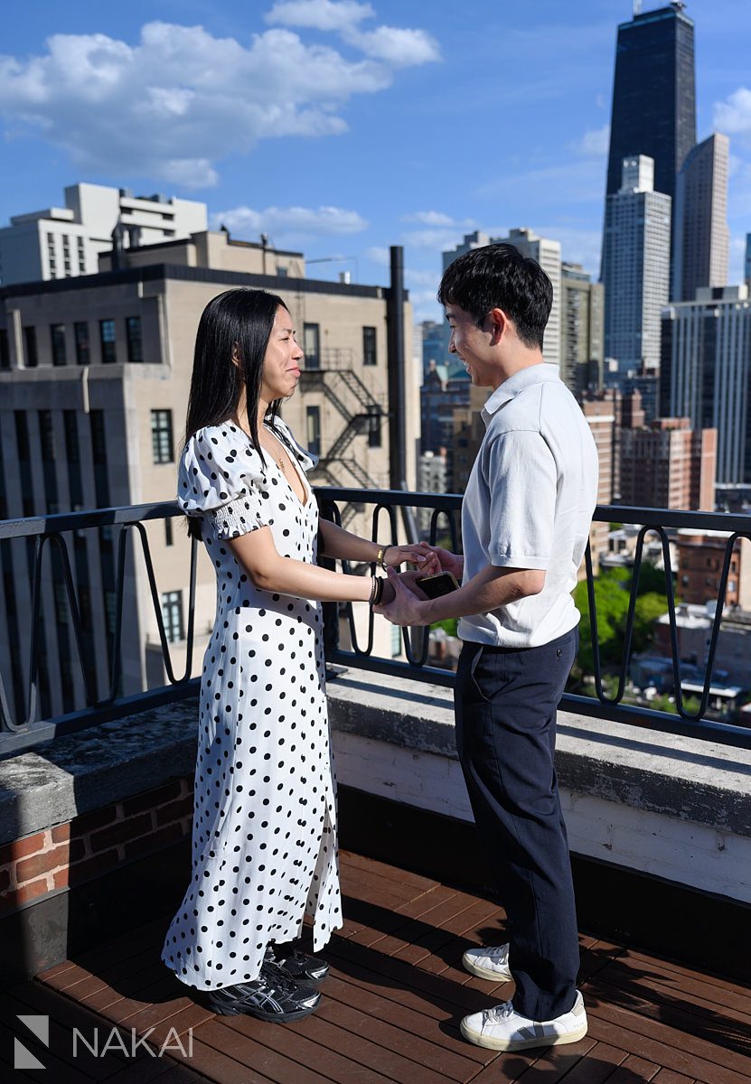 laughing at chicago proposal rooftop at Ambassador Hotel