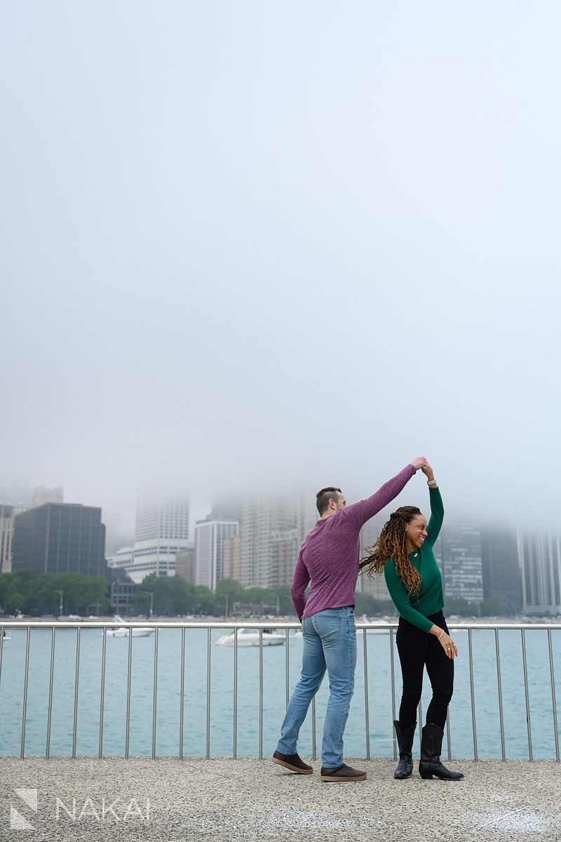 dancing twirl during engagement chicago lakefront photos