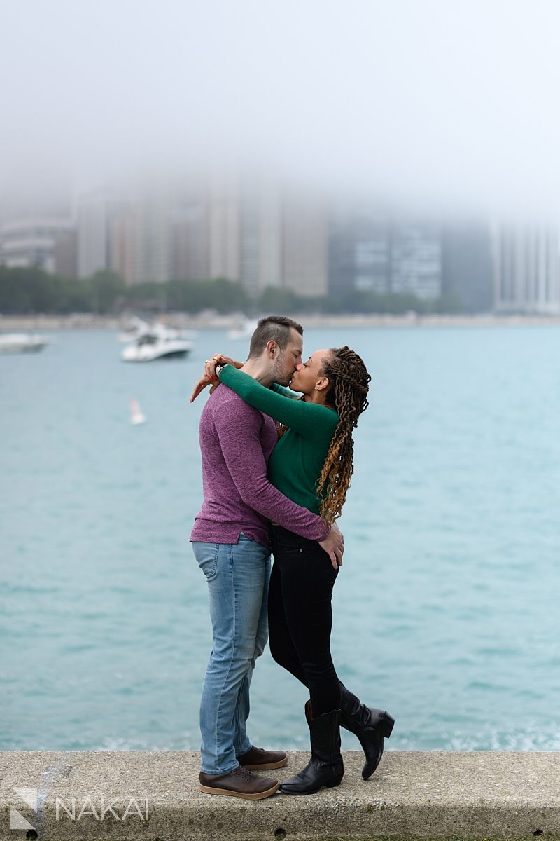 kiss next to water engagement photos chicago lakefront