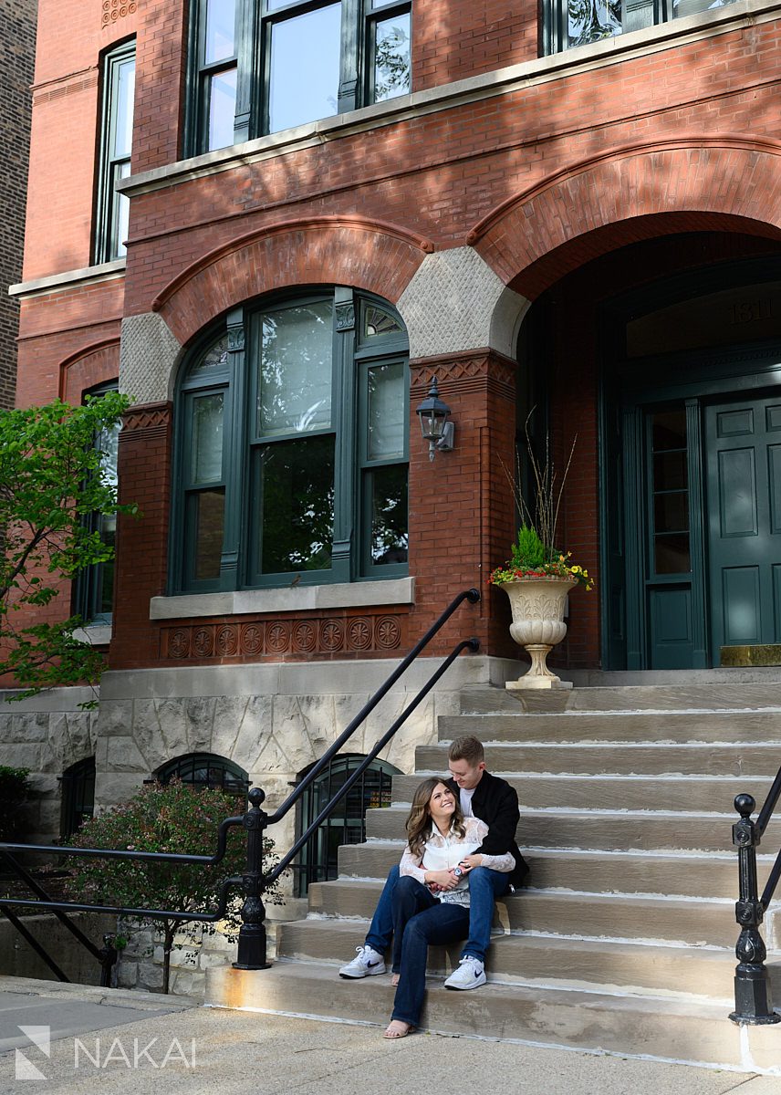 old town chicago engagement couple sitting on brownstone steps