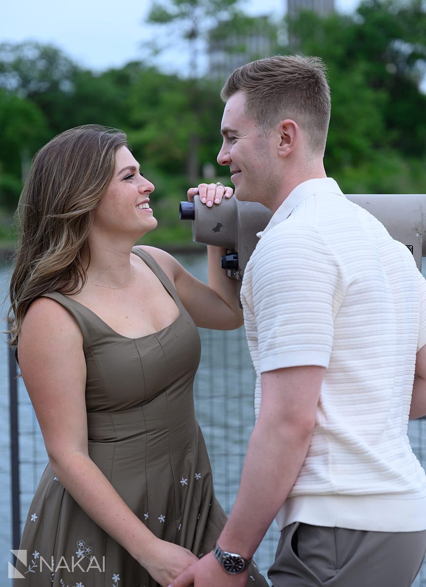 couple with telescope in south pond chicago engagement photo