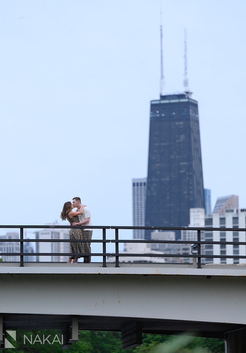 couple on bridge w/john hancock south pond chicago engagement photo