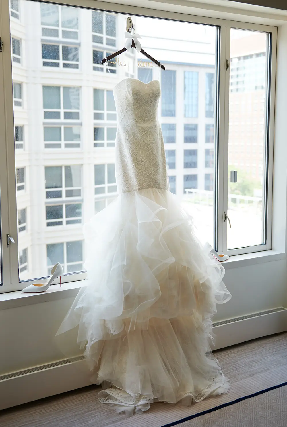 wedding dress hanging in chicago peninsula window