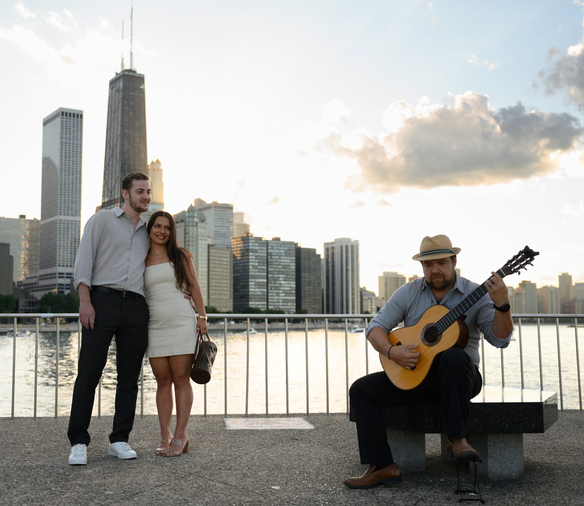 listening to guitarist for fake out suprise proposal chicago at olive park