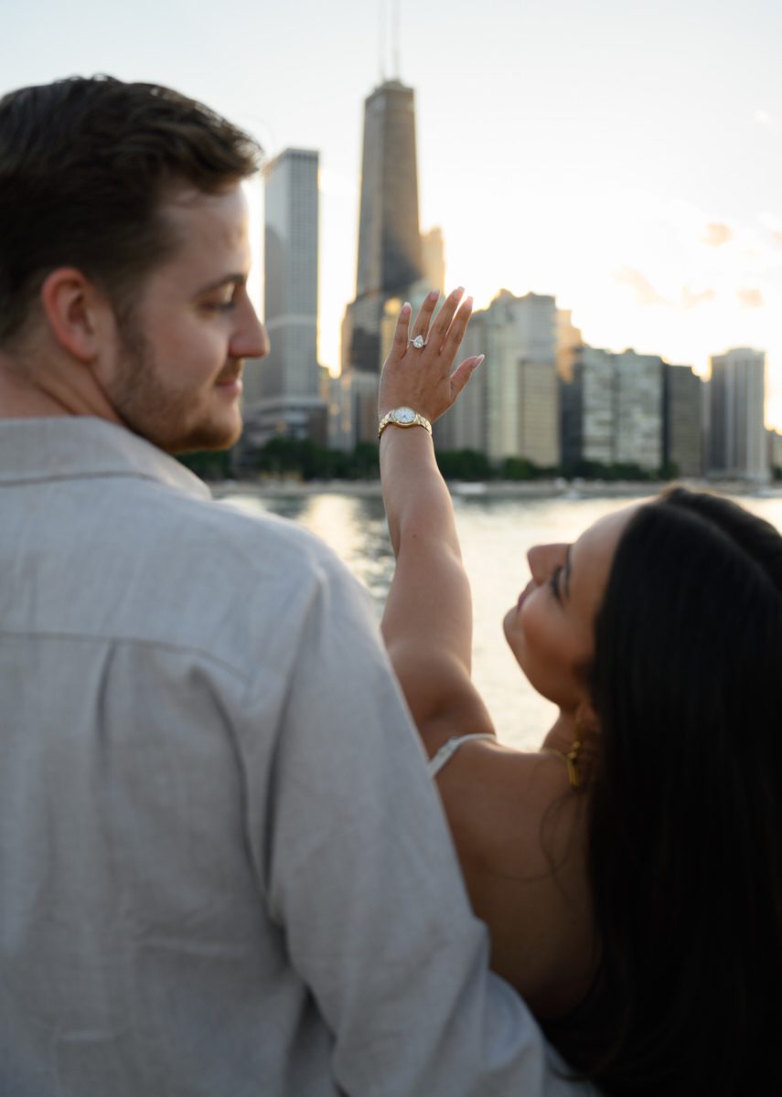 looking at skyline during fake out suprise proposal chicago olive park