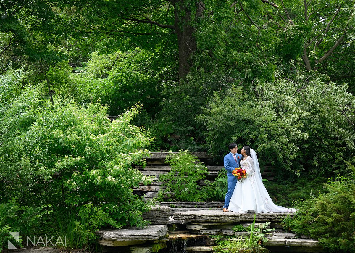 bride and groom embrace in alfred caldwell lily pool wedding photos