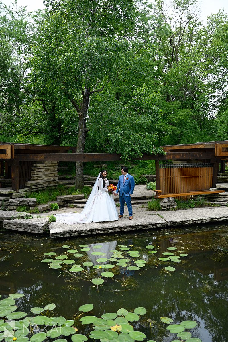 caldwell lily pool wedding photo bride and groom holding hands