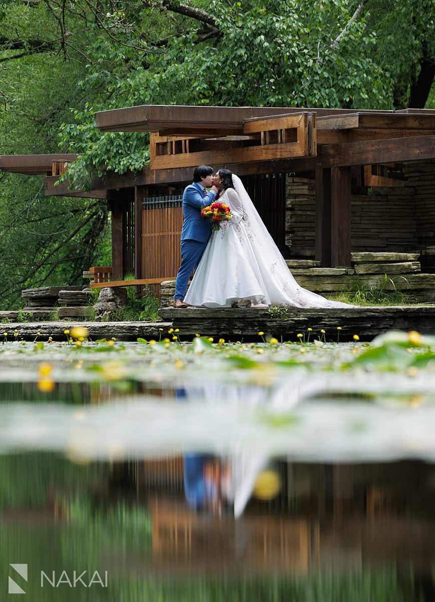 bride and groom kiss at caldwell lily pool wedding photos