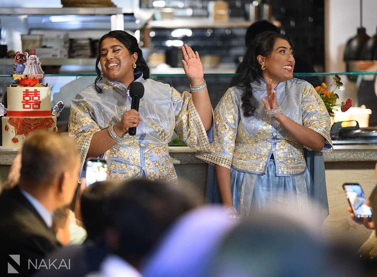 sisters giving toasts at wedding in chicago restaurant