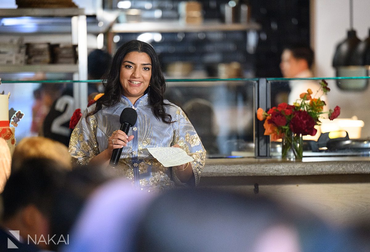 friend giving toast at wedding in chicago restaurant