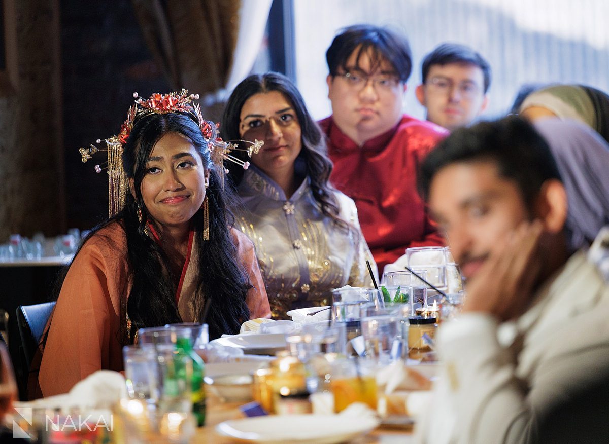 bride listening to toasts at wedding in chicago restaurant