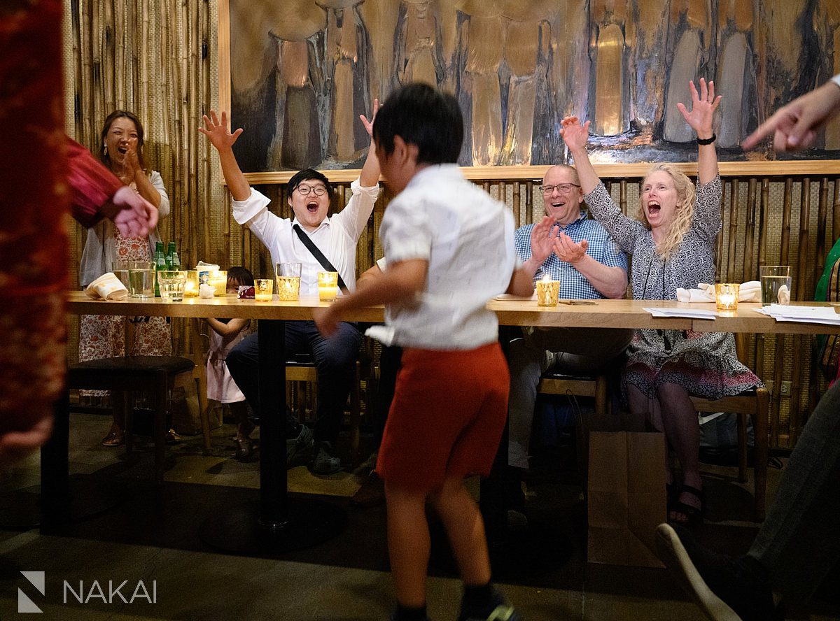 cheering after game at wedding reception in restaurant