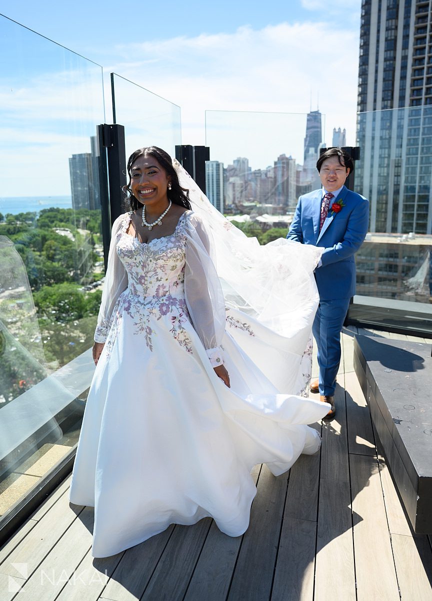 hotel lincoln wedding rooftop walking groom carrying dress