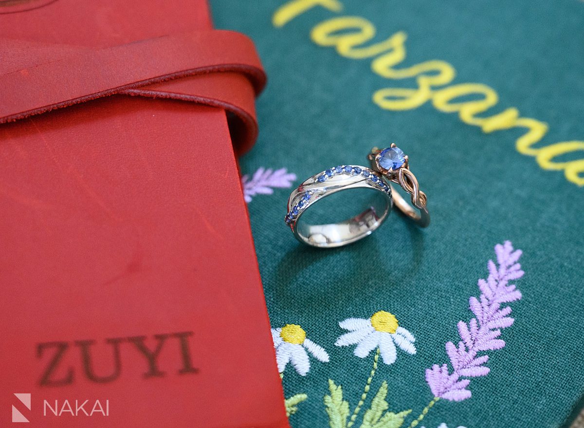 close up of rings with blue diamonds