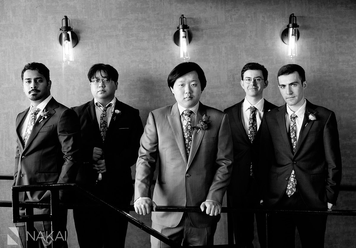 groomsmen standing in black and white