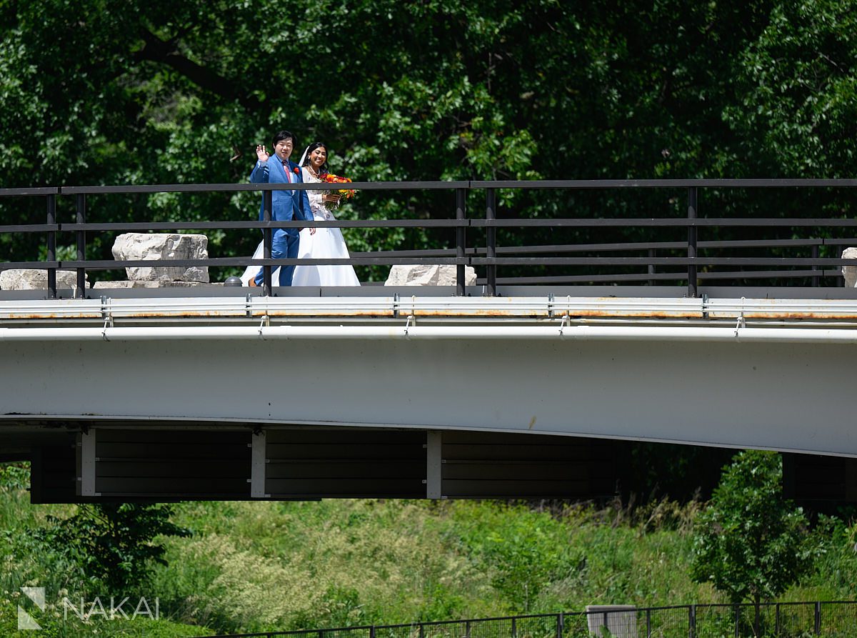 lincoln park wedding photo walking on bridge to honeycomb