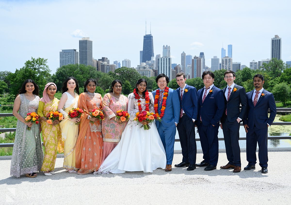 lincoln park wedding photos multicultural wedding party on bridge