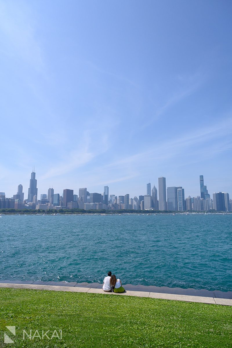 sitting on concrete looking at skyline at Adler Planetarium