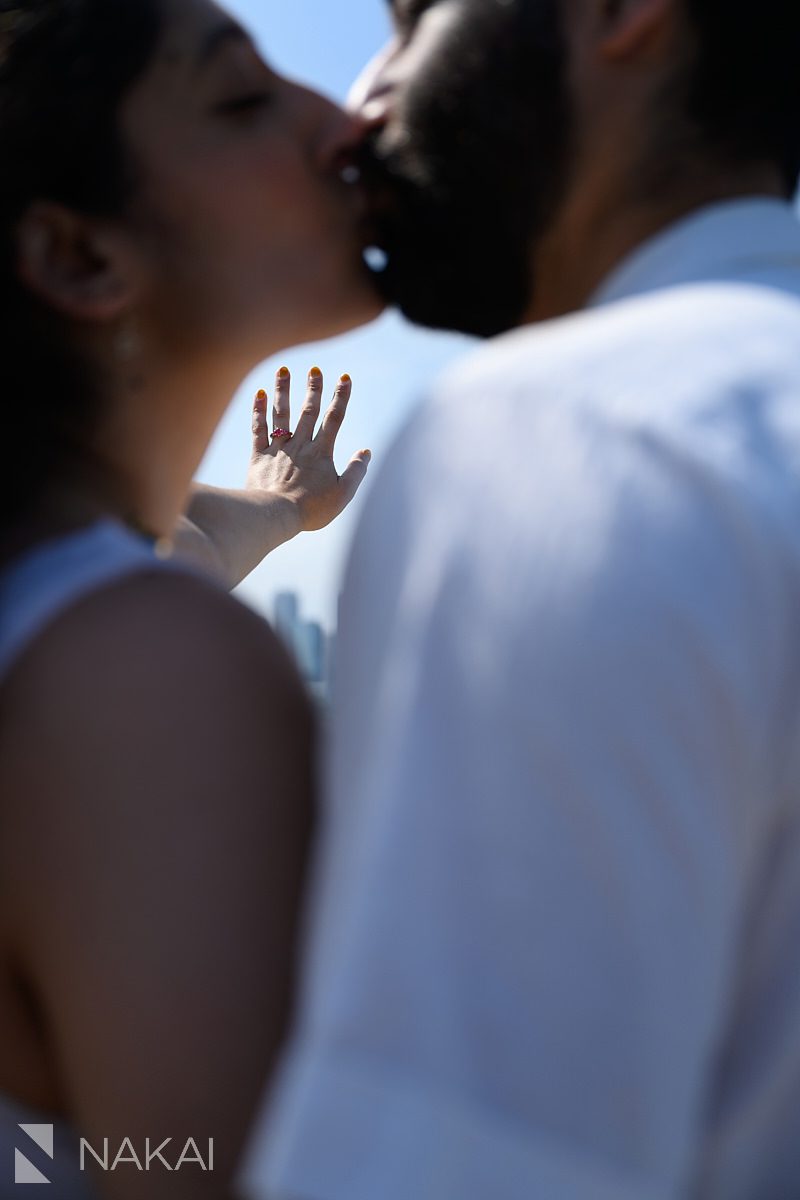kiss while focused on ring during chicago adler planetarium proposal