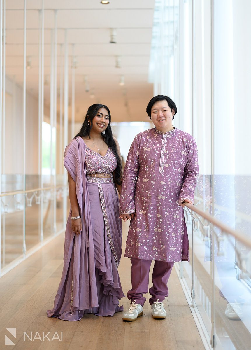 couple standing in chicago art institute engagement photo
