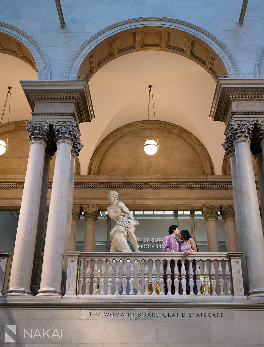 couple under arch in chicago art institute engagement photos