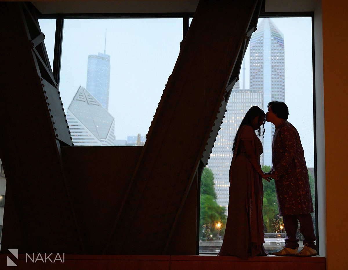 indoor silhouette, rain outside for a rainy day engagement photo
