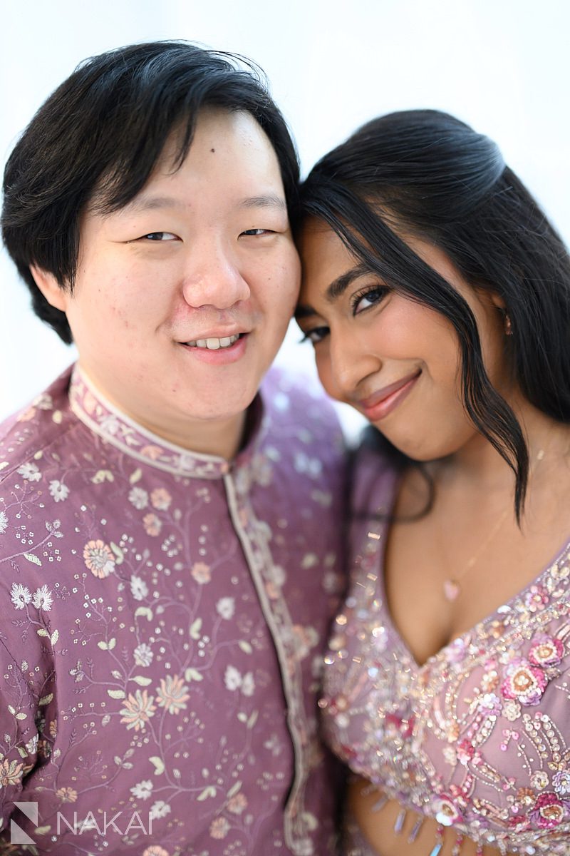 south asian multicultural couple wearing lavender formal wear