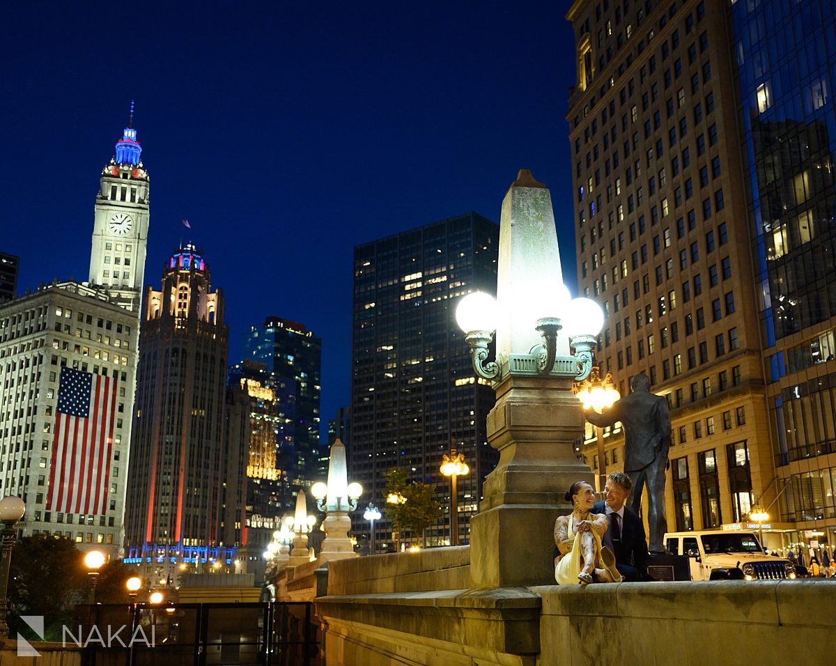 sitting on bench chicago riverwalk engagement night time