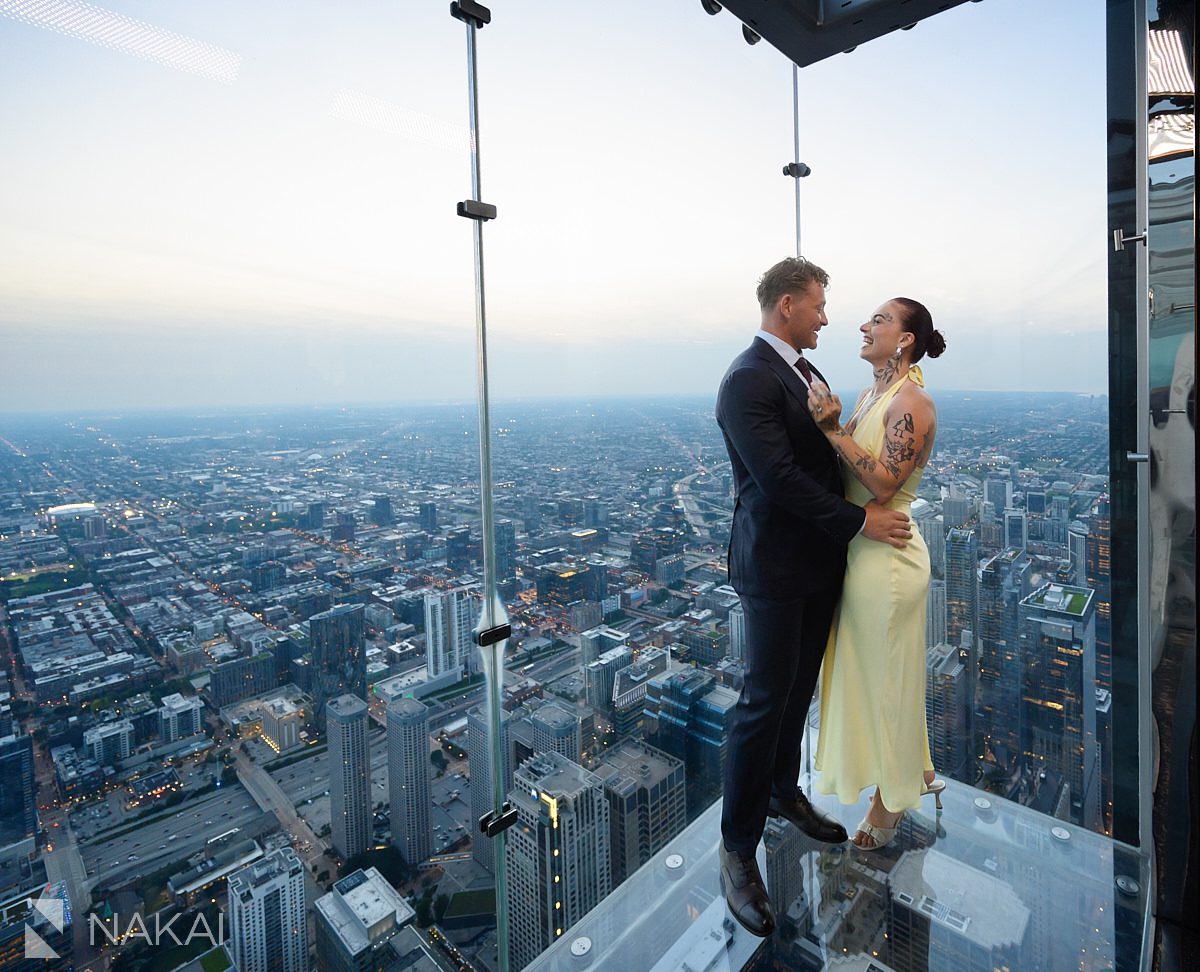 wide city shot at with couple at chicago willis tower proposal 