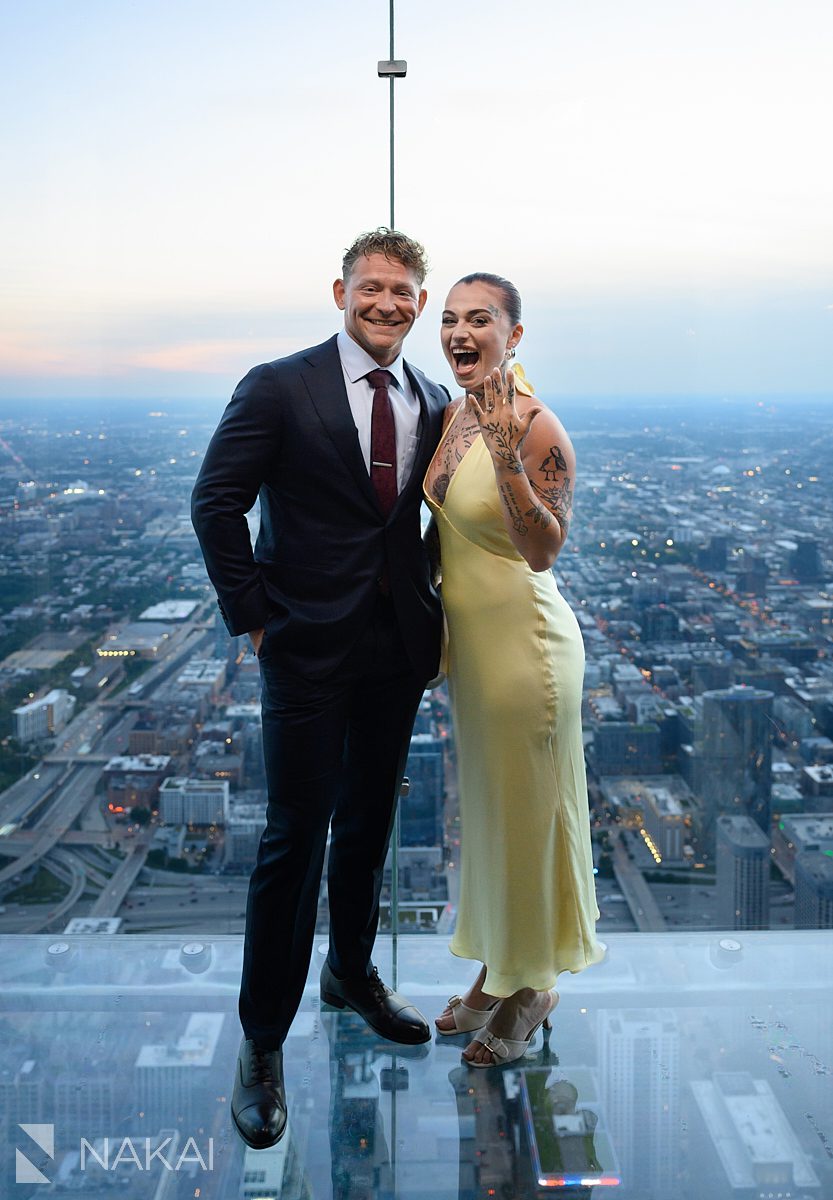 showing off ring at chicago willis tower skydeck proposal 